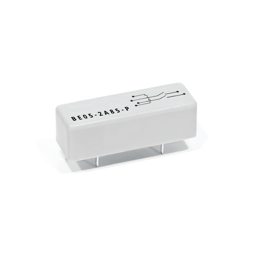A white rectangular Reed Relay from the BE Series, featuring four metal pins on the bottom, circuit diagram markings, and the label BE05-2485-P printed on top. by Standex Detect