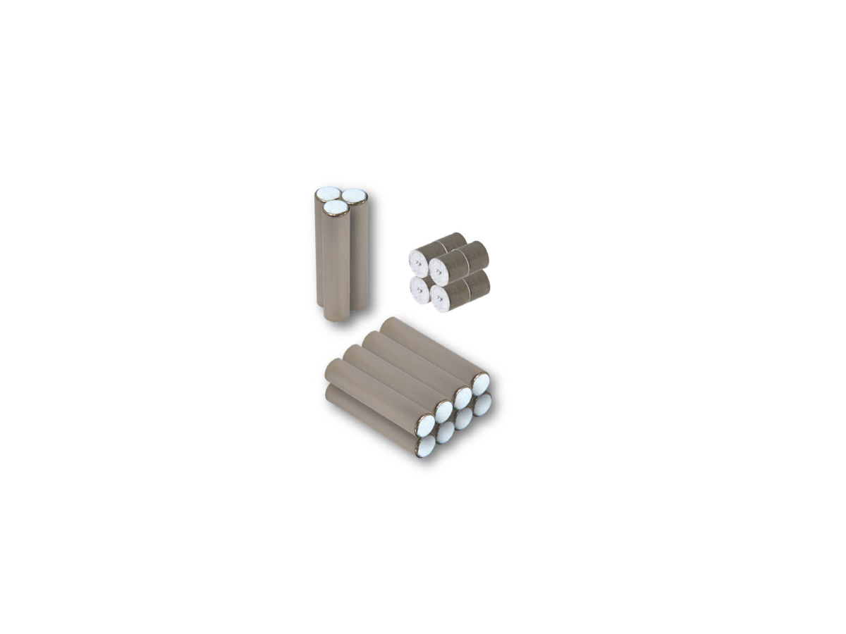 Three groups of gray cylindrical AlNiCo magnets with white ends are arranged on a white background; one group of four, one of six, and one of seven rods. by Standex Detect