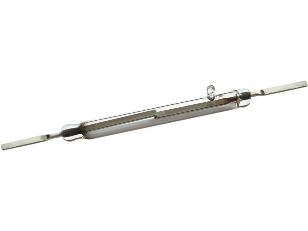 A close-up view of a KSK-1A83 Reed Switch, showing its glass tube body with two metal leads protruding from each end and a visible contact inside the tube. by Standex Detect