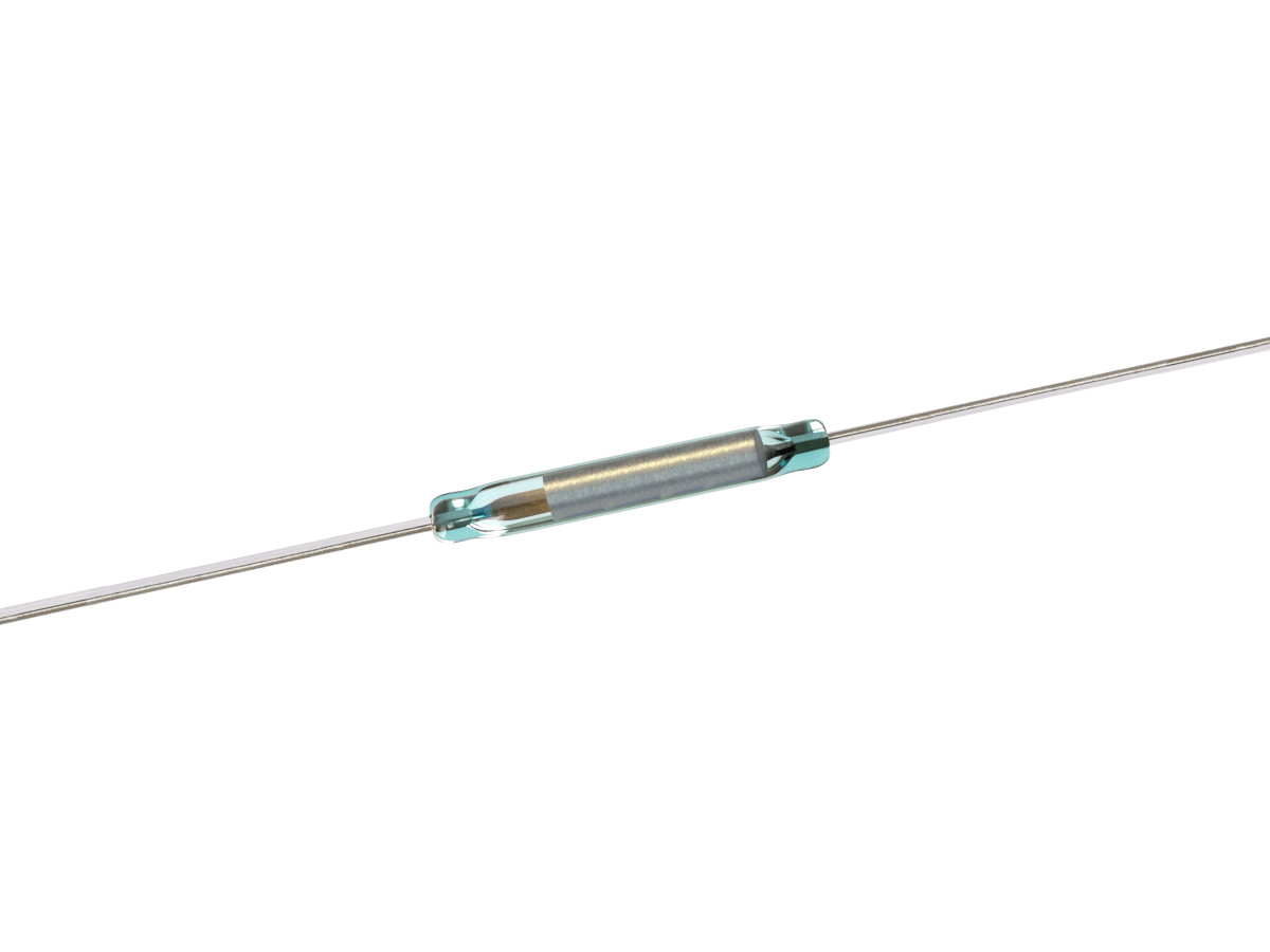 A close-up of a KSK-1E85 Reed Switch with metal leads extending from both ends, used as an electrical component for detecting magnetic fields in the Series. by Standex Detect