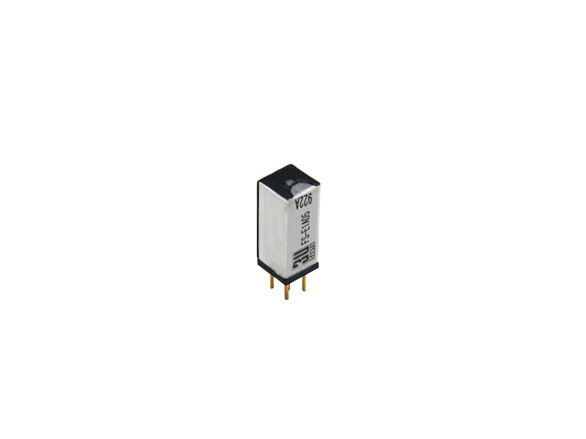 A small rectangular FS Series Reed Relay with two gold pins at the bottom, silver and black casing, and printed text on the side, isolated on a white background. by Standex Detect
