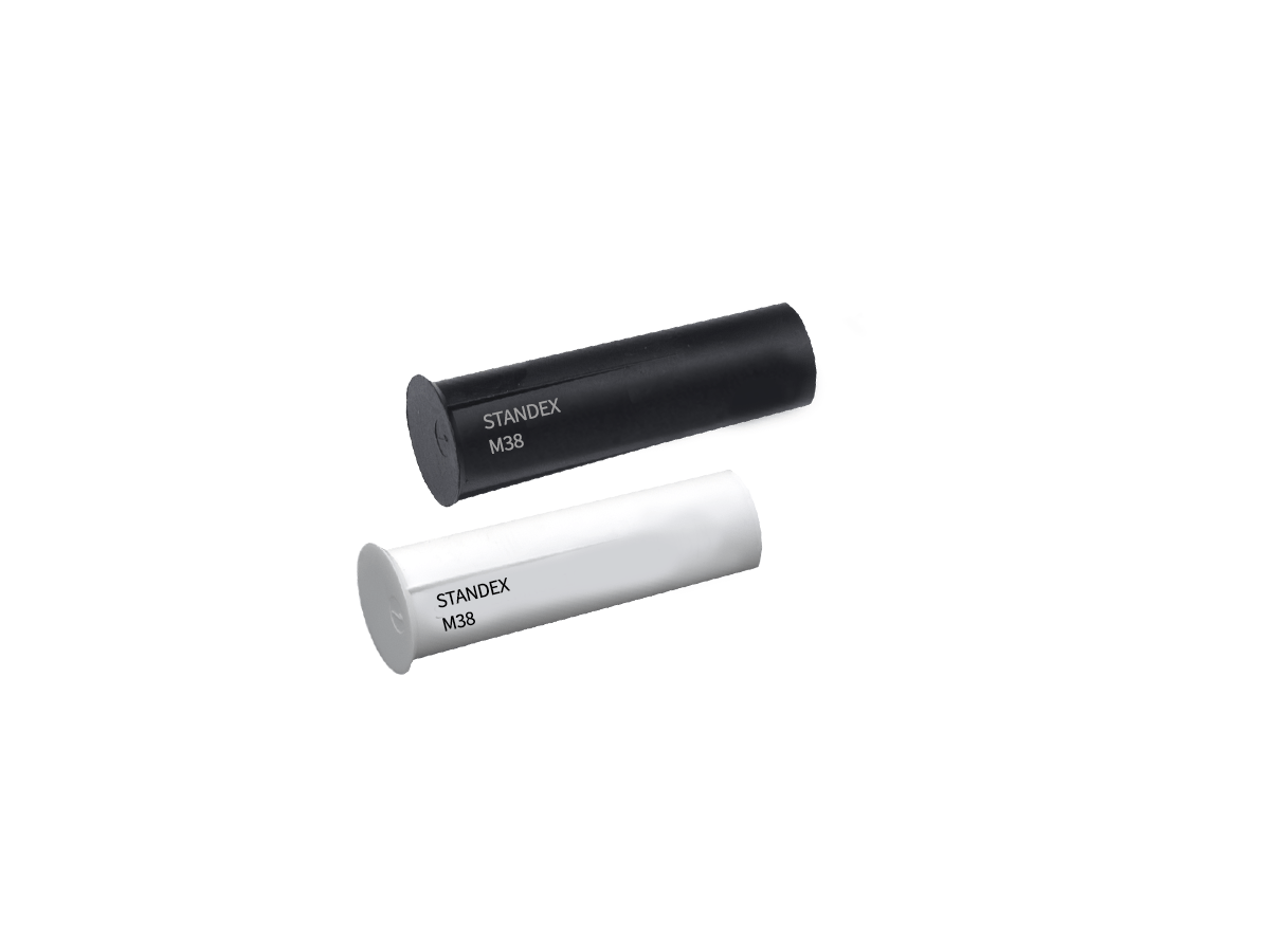 Two cylindrical electronic components, one black and one white, both labeled STANDEX M38, possibly part of the M36 series magnet line, shown on a white background. by Standex Detect